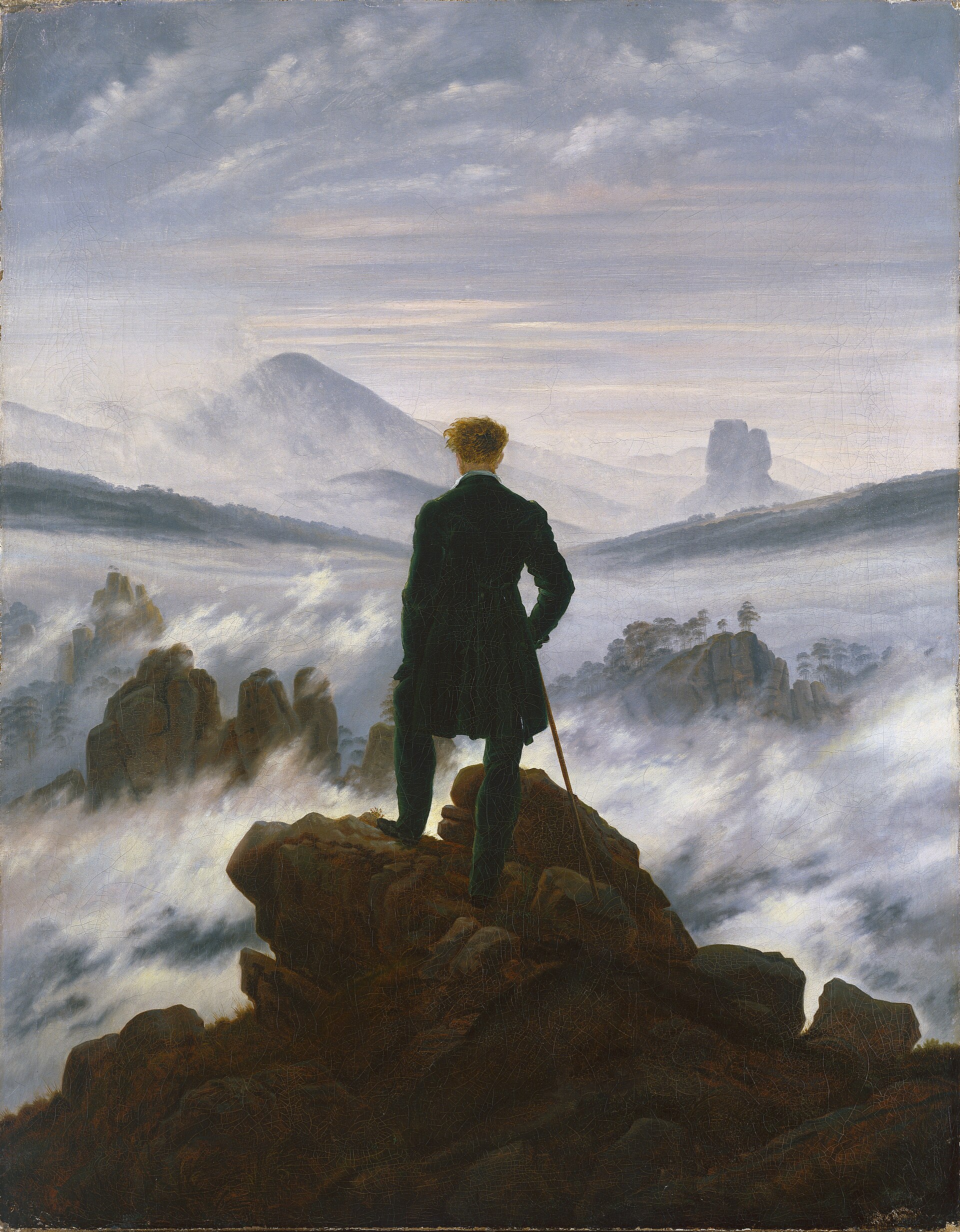 Wanderer above the Sea of Fog — a lone figure looking out across mist-covered mountains